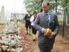 Virginia SAR President Darrin Schmidt placing Virginia Soil on the mass graves of Virginia Patriots killed at the Battle of the Waxhaws