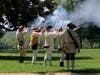 Replica Black powder flintlock musket and rifle volley honoring Patrick Henry.  Commanding the fire squad is Ken Bonner far right