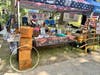 one table displaying give aways with replica Boston tea party tea boxes and a hoop for a game