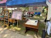 A desk for public signing of the Declaration of Independence.  To the left is an antique box used to carry the stuff used by a Rev War Patriot