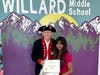 Presentation of a $300 check and certificate.  L-R:  Barry Schwoerer, Ineya Zaman