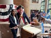 Ken Bonner with newly naturalized citizen after signing a copy of the declaration of Independence