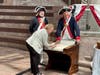 Jim Cordes and Ken Bonner with a newly naturalized citizen signing a copy of the Declaration of Independence