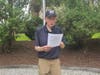 Barry Schwoerer presenting "Old Glory" before the Flag retirement ceremony