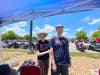 Karla and Martin Gainey with motorcycles in the background, at the Parking lot a the VA Medical Center, Martinsburg, WV