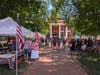 SMJC booth to left, Charles Hamilton Houston Courthouse straight ahead with the SMJC team reading the Declaration of Independence