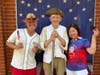 Barry Schwoerer "Revolutionary War Soldier" flanked by visitors