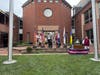 Reading the Declaration of Independence and ringing a bell.  Bell on far right with Warner Workman