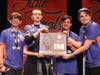 Stagg Mario Kart team (left to right) junior Nik Bezanis, senior Cole Wycislak, sophomore Jack Gawel, and senior Paul Cisko receive their state championship plaque at the recent IHSA state competition.