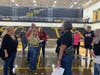 District 230 Director of Assessment Dawn Reuter Cox, Andrew alumna and former teacher, takes fellow former classmates on a tour of their alma mater.