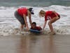 Liam Johnson and his mentors couldn't keep out of the water as the young boy loved boogie boarding in the waves and playing with the sand.