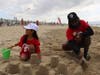Sofia and her mentor Leon build sandcastles together at P.S. I Love You's 21st annual Day at the Beach.