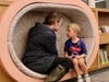 A mother and her child enjoy the newly renovated library at Sherwood Elementary School.