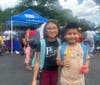 Two happy backpack recipients try to keep cool on a hot day! 