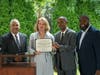 Town of North Hempstead Supervisor Jennifer DeSena (second from left) presents a proclamation to the Westbury Water District Board of Water Commissioners in recognition of the completion of the District's new headquarters