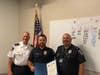 Decatur Police Sgt. Joshua Speed is recently given the Lifesaving Award from Decatur Police Chief Scott Richards and Deputy Chief Mike Matics for providing aid to a man in a car accident.