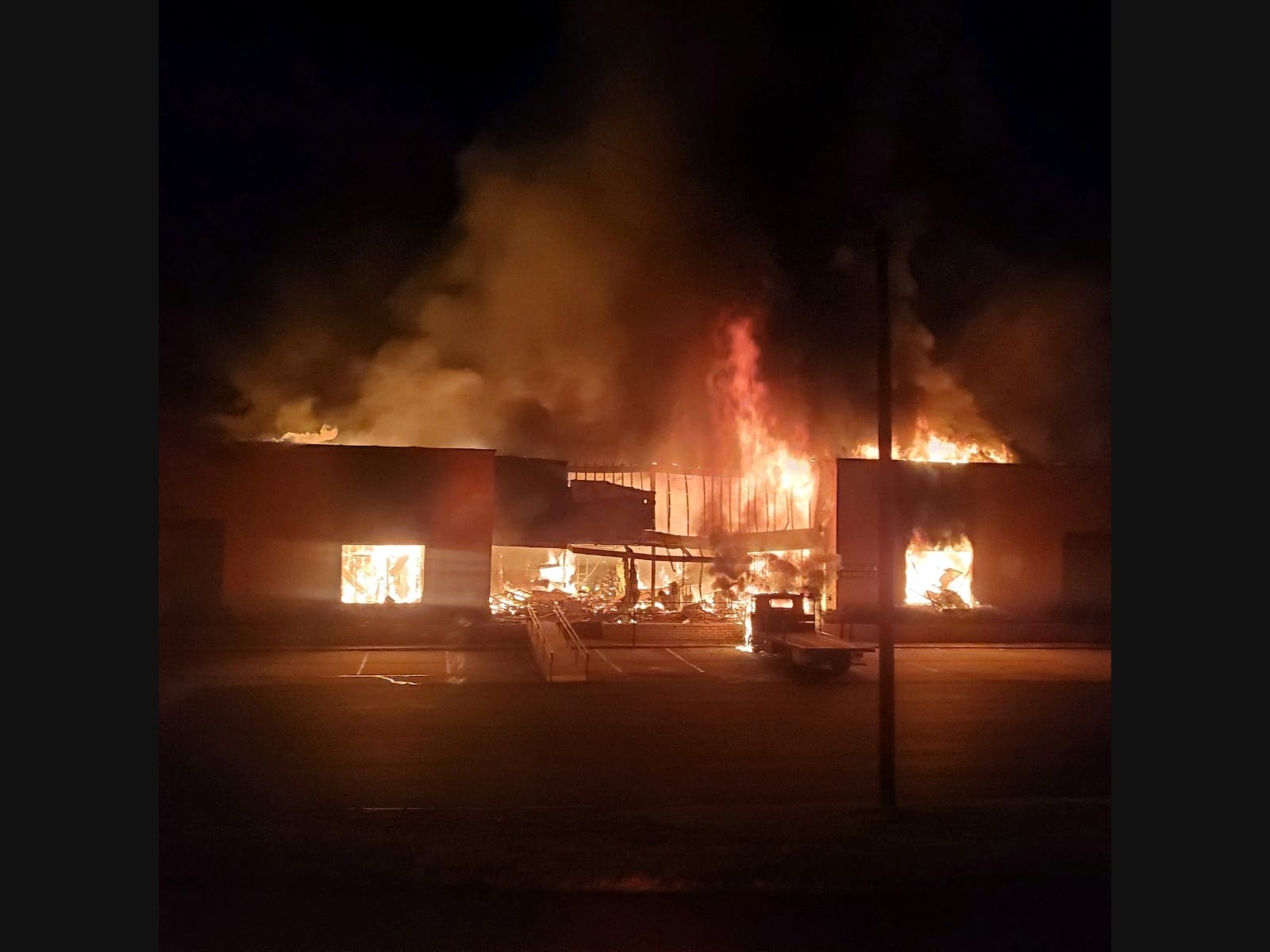 A two-alarm fire impacts a large commercial business plaza Tuesday at the 100 block of Selig Drive.