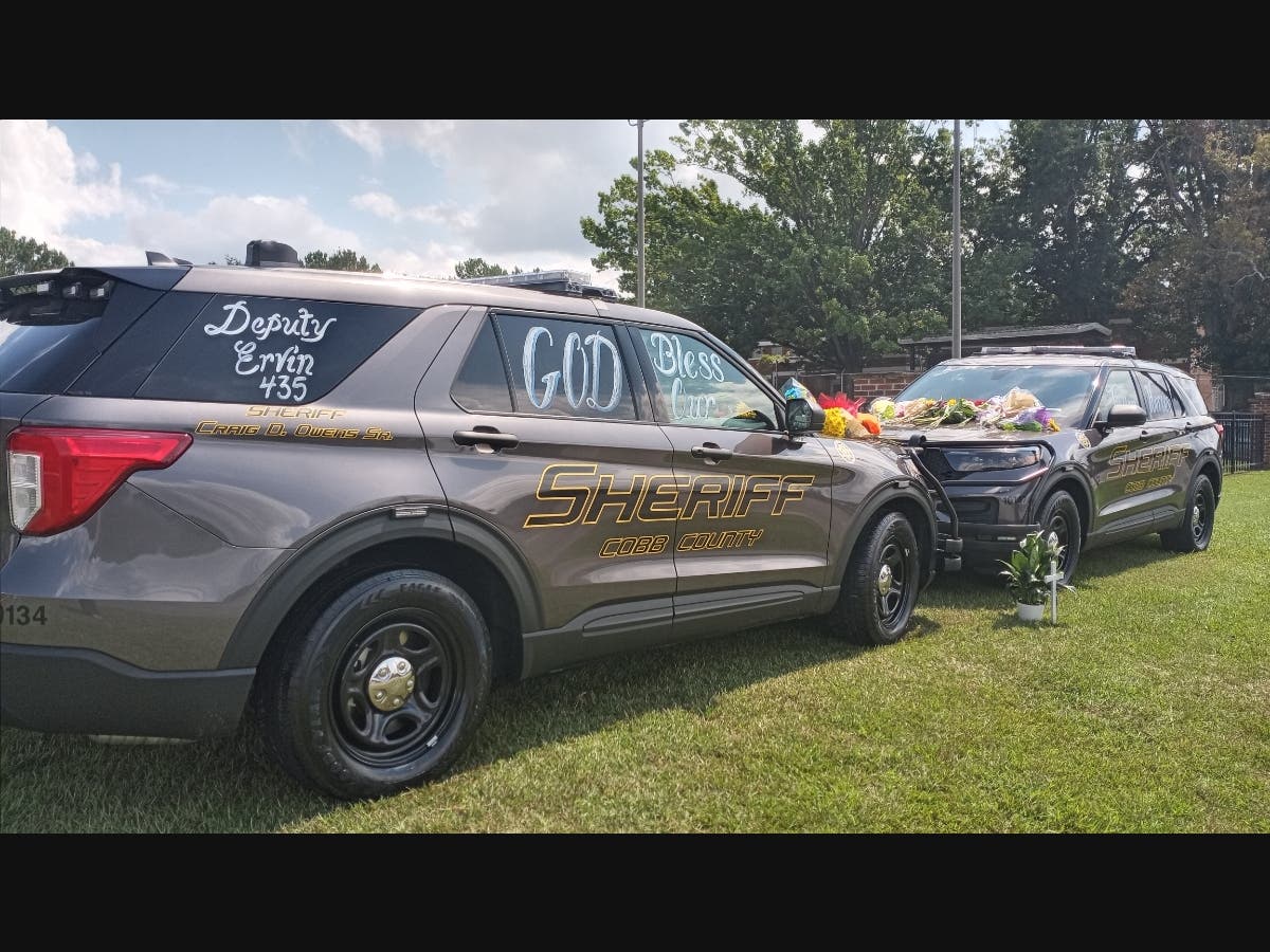 A memorial is set up at the Cobb County Sheriff's Office Visitation Center in honor of late deputies Jonathan Koleski and Marshall Ervin Jr., who died on Sept. 8 while in the line of duty.