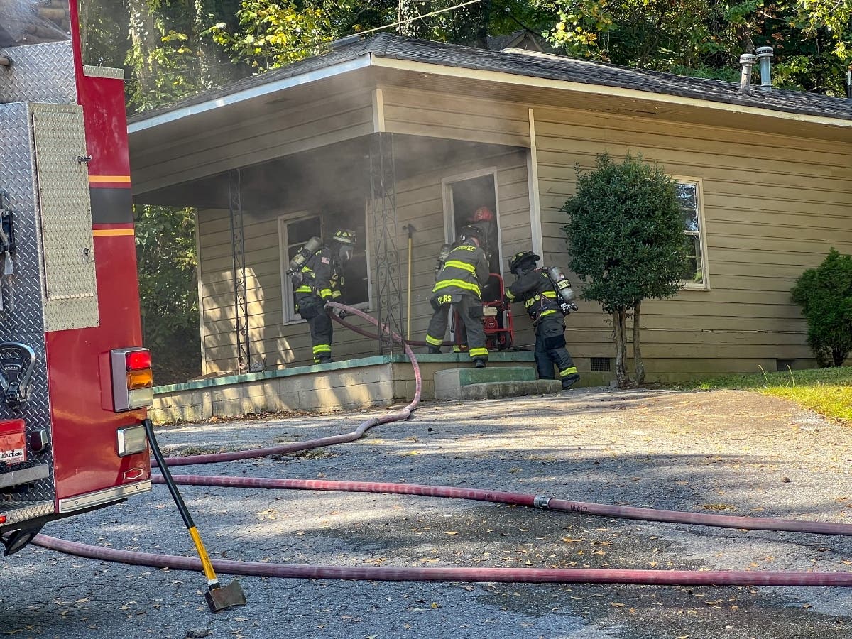 Cherokee County Fire and Emergency Services respond to a structure fire at Harmon Circle Friday.