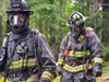 Cherokee County firefighters respond Tuesday to a fire at Hogan Pond Lane.