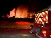 A blaze threatens Garland Mountain Sporting Clays and Grill in Waleska Thursday.