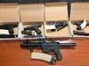 Four handguns and a stolen AR-15 rifle are recovered Wednesday in a Parkview Homes residence.
