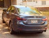 The Cherokee County District Attorney's Office says a blue Mazda was seen on camera in the area where a May 2022 drive-by shooting took place in the Carmichael Farms community.