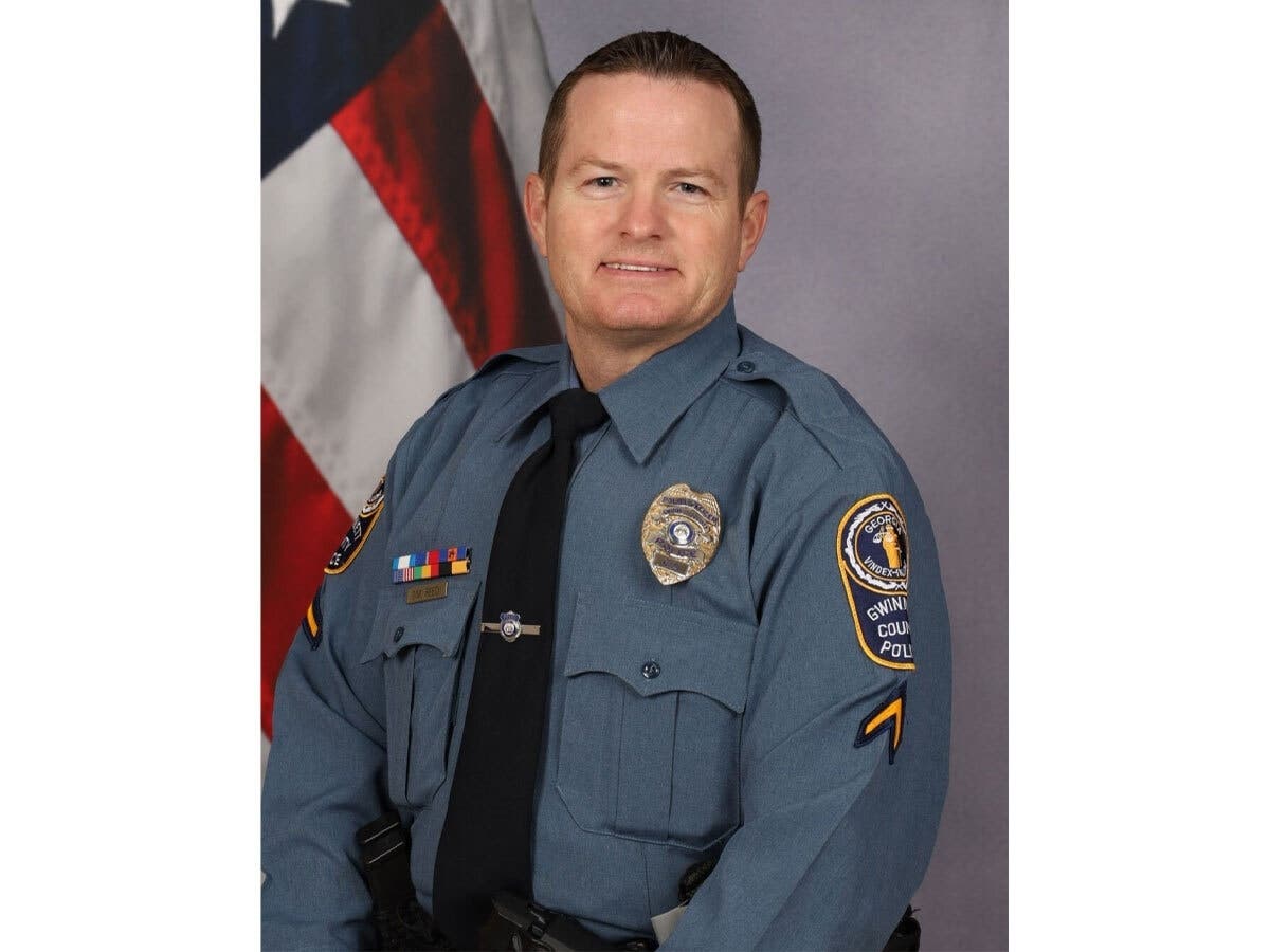 Master Police Officer David M. Reed, of the Gwinnett County Police Department, continues to recover after being injured in a hotel shooting Sunday in Stone Mountain. His fellow officer died in the shooting.