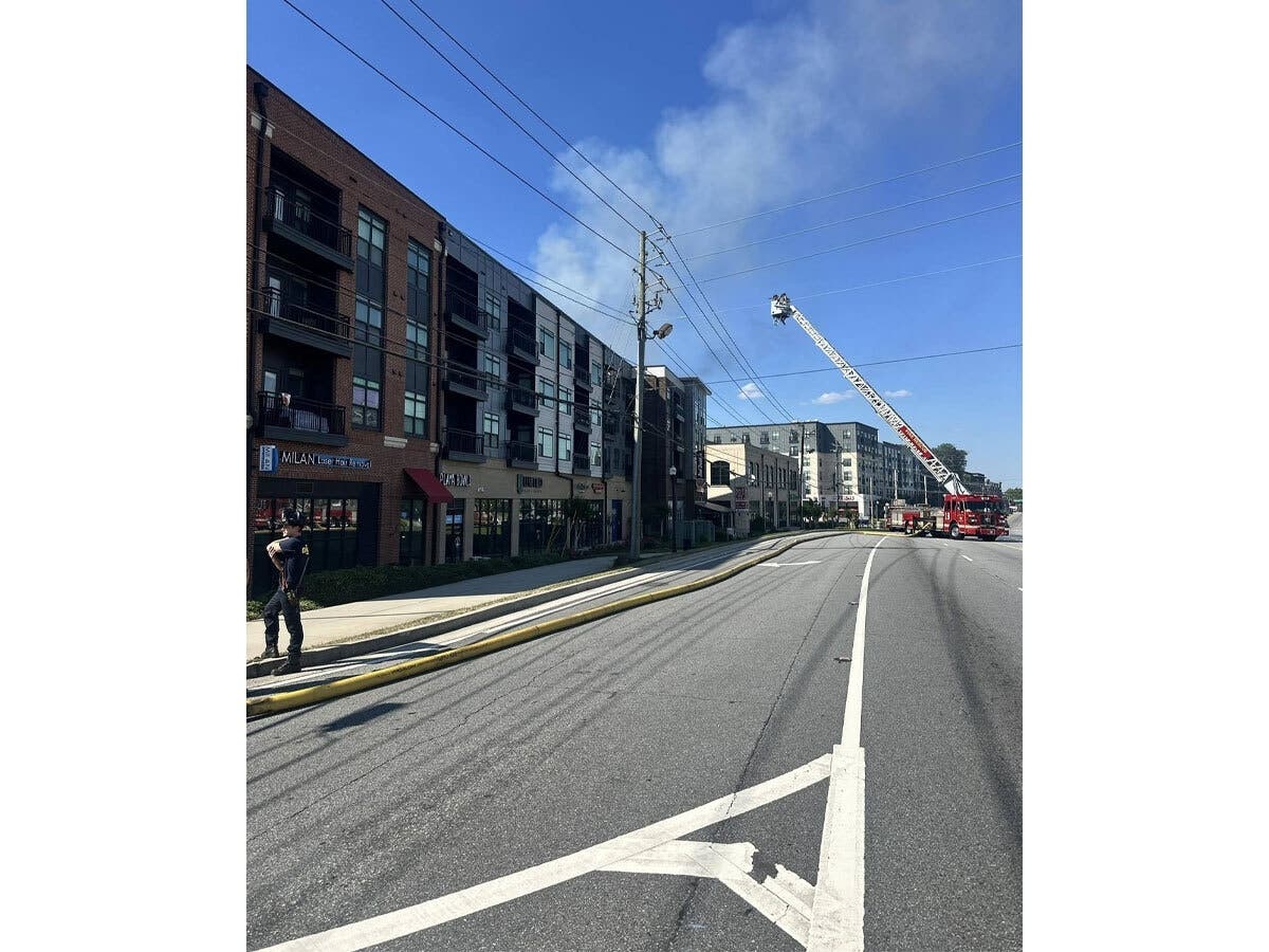 DeKalb County firefighters respond to an apartment blaze Sunday at Peachtree Boulevard.