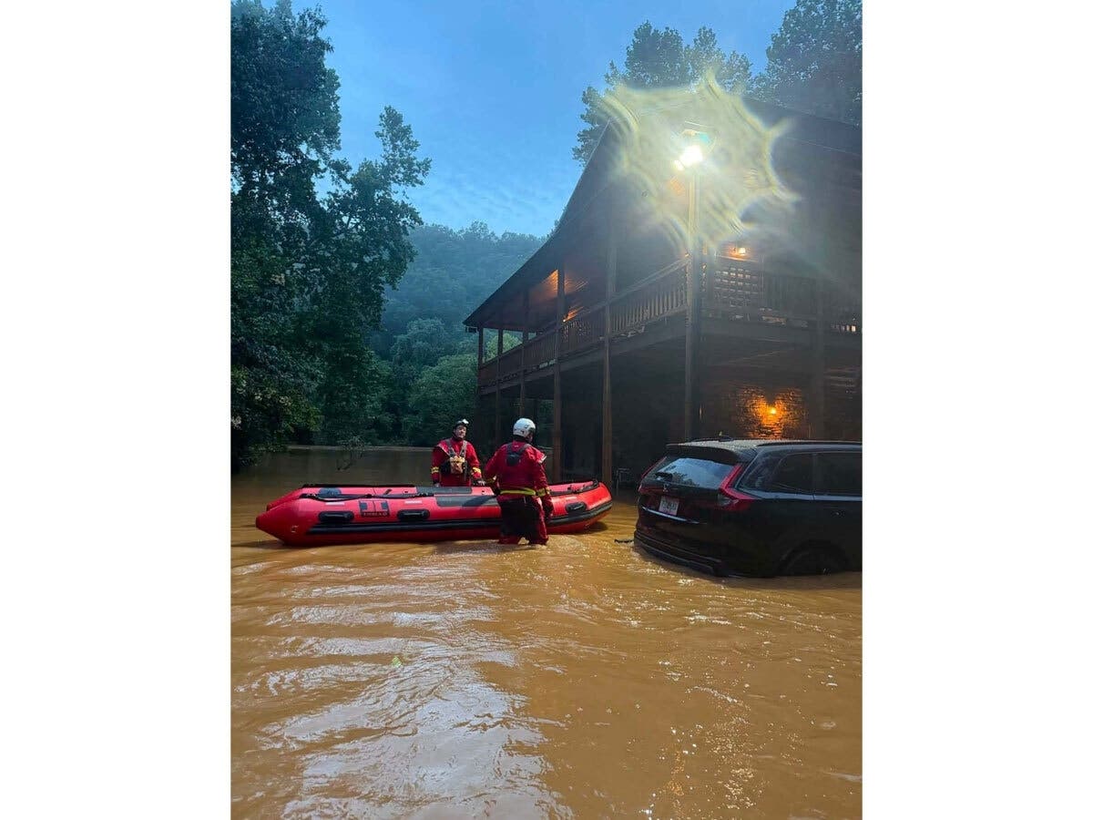 Emergency crews in Fannin County respond to flooding Sunday in downtown McCaysville.