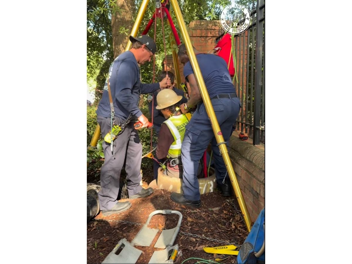 Atlanta Fire Rescue crews on Monday rescue a worker who was trapped in a 20-foot sewer access.