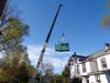 Crane lifting out the old generator at Paxson Hall.