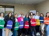 Bank of America distributes backpacks.