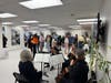 Orchestra Lumos of Stamford plays at the event while visitors gather and walk through the exhibit. 