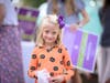 Milton resident Vivian Massey had lots of fun helping to hand out Boo signs to her friends and neighbors who attended the kickoff party.