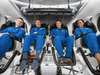 NASA's SpaceX Crew-8 members, (from left) Alexander Grebenkin from Roscosmos; Michael Barratt, Matthew Dominick, and Jeanette Epps, all NASA astronauts, are pictured training inside the Space X Dragon spacecraft in Hawthorne, California.
