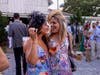 Guests donned colorful dresses, hats, fascinators, and an impressive array of cowboy boots.