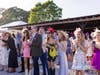 Fans cheered wildly during a live running of the Derby which was projected on a jumbotron screen. 