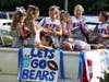 NAFL cheerleaders worked diligently to outfit their pickup truck before the parade.