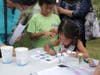 Participants identifying insects at a Bug Week event in 2022.