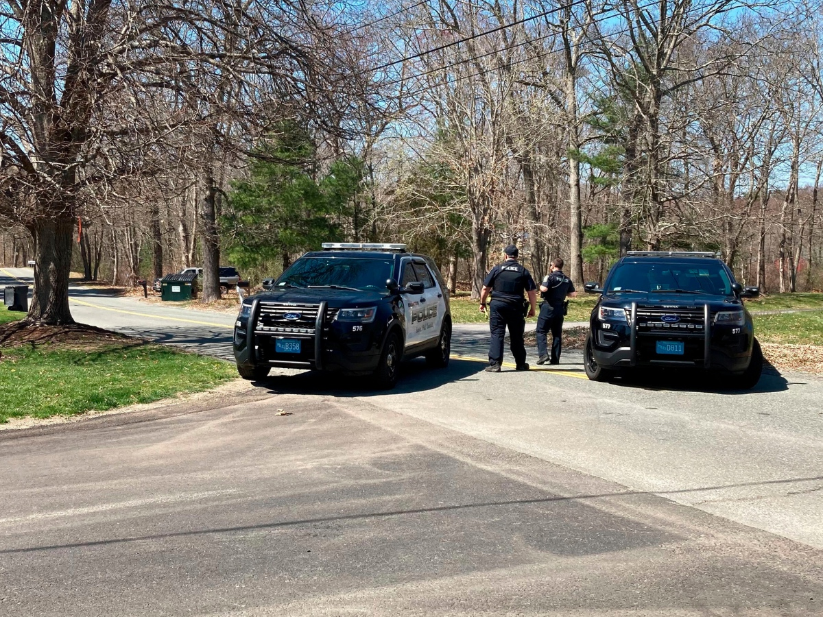 Police block a road in North Dighton, Mass., Thursday, April 13, 2023. 