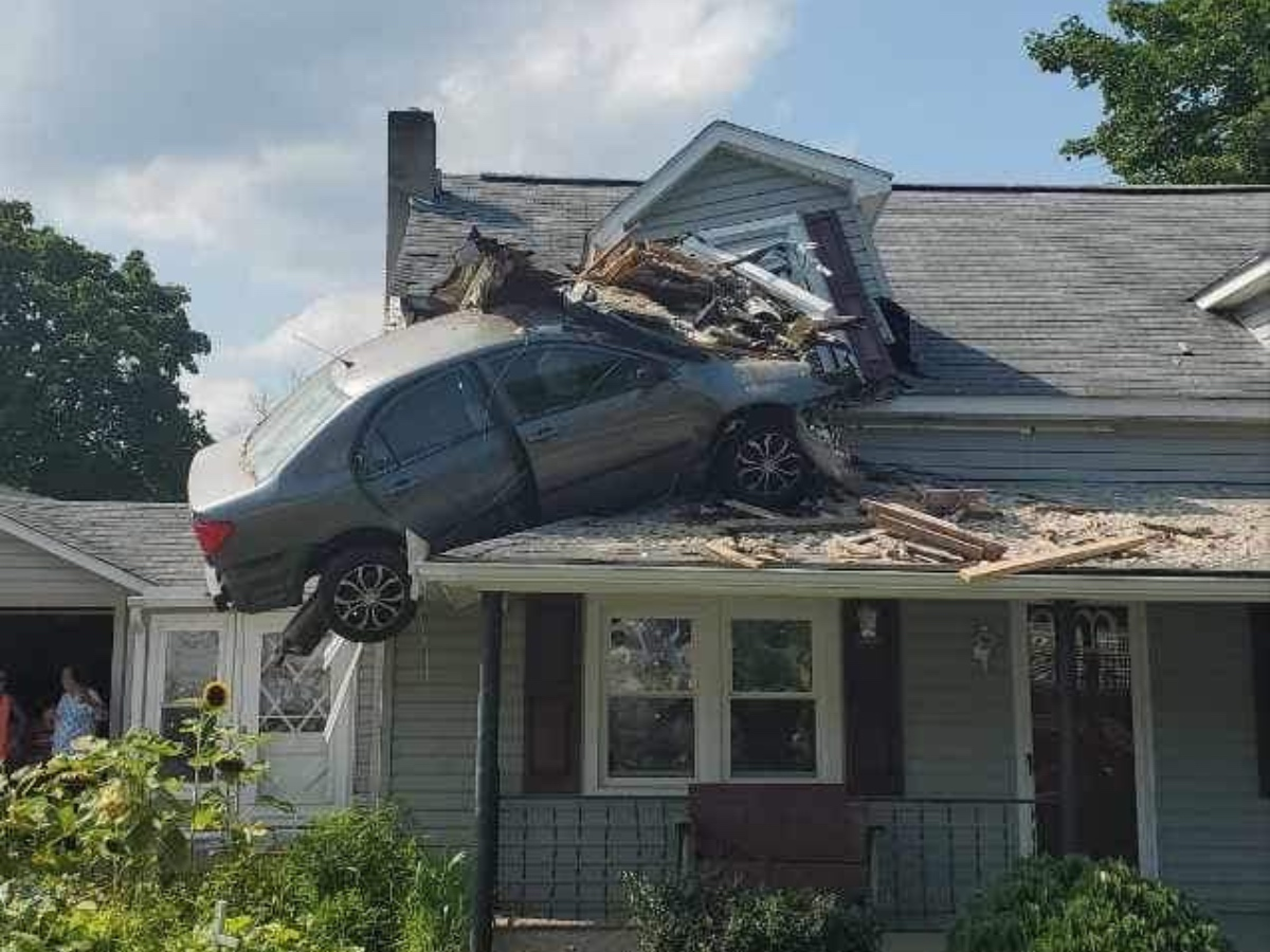 Officials said that they were able to remove the car from the roof, stabilize the house, and help the homeowners put a tarp over the gaping hole to protect the house as storms roll in.