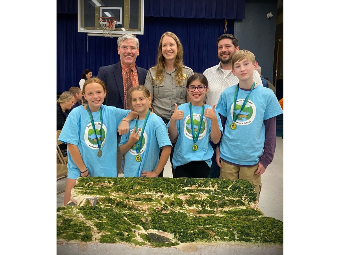 First row, from left, Riley Dill, Madison Lloyd, Isabella Mills, and Caleb White. Second row: Superintendent-Principal Brian Connelly, Ranger Briana Edwards, and parent Josh Gilman. Not shown: Dave Sias.