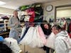 Volunteers with experience sewing and designing help train the students on the Costume Crew 