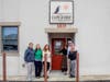 ​L-R: Detective Mary Rybicki, Cape Assist’s ED and CEO Katie Faldetta, Chelysmaly Cruz,  Specialist Temerity Berry, Vanessa Fales, Prosecutor's Office community outreach coordinator Captain Joseph Landis, showcasing their SAFE PLACE Stickers