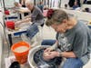 Student Mack McKernan is shaping the bowl. 
