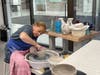Student Sharon Angelini is stretching the bowl.