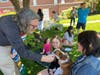 Pastor Chris Lyman Waldron blessing a pet at the Blessing of the Animals at MHCC in June.