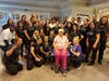 Students from Total Image Beauty Academy pose for a photo with a resident of Juniper Village at Paramus, who received complimentary beauty treatments.