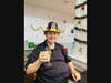 A resident sporting a festive hat raises a glass in celebration of the New Year!